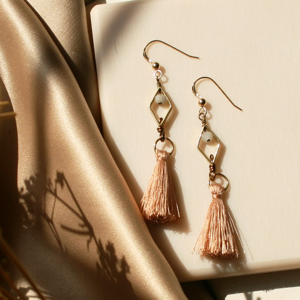 The Sky from Bucharest Earrings is handcrafted from the 14K Gold-filled wire hook, premium Japanese silk thread, Natural Morganite with dazzling brass charm.