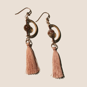 The Twilight Zone in Romania Earrings is handcrafted from the 14K Gold-filled wire hook, premium Japanese silk thread, Natural brown opal 8mm round Smooth opal, with dazzling brass charm.
